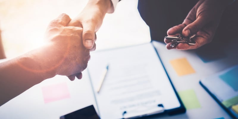 Lawyer and customer shaking hands after good deal